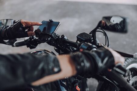 Caucasian motorcyclist enjoying his new modern motorbike