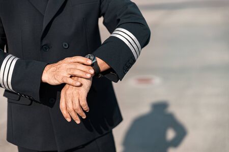 Close up of man in costume hurrying for flight stock photo. Airways concept