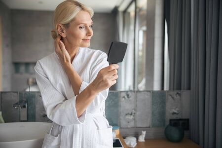 Charming female person enjoying her perfect skinの写真素材