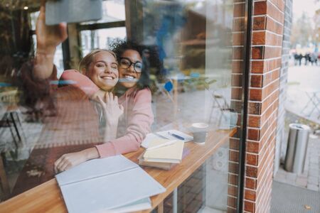 Two young women are making selfie photo