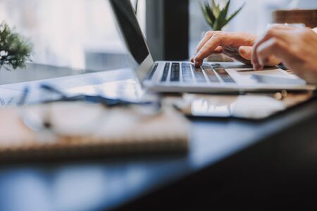 Cropped photo of male worker typing on keyboard. Business concept