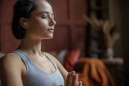 Close up of yoga girl meditating with closed eyesの写真素材