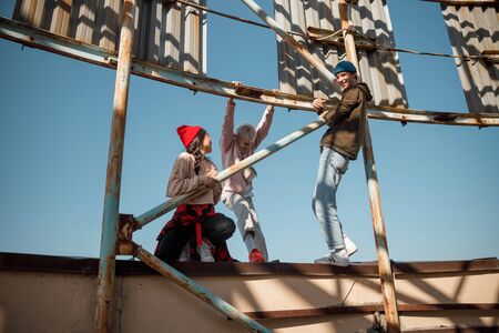 Happy friends having fun on the rooftopの写真素材