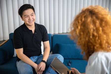 Happy man on interview indoors stock photo