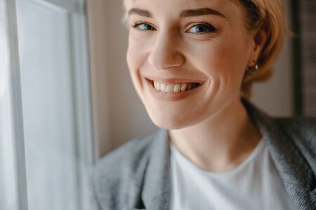 Beautiful young woman is looking at camera