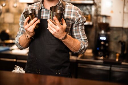 Cropped photo of barman holding shaker stock photoの写真素材