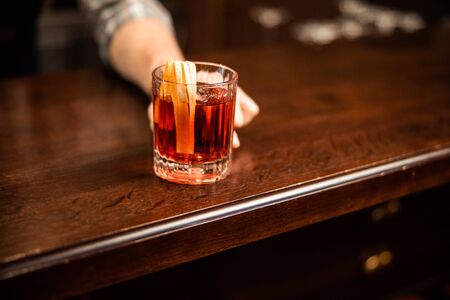 Cropped photo of glass with alcohol at the bar stock photo