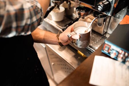 Top view of male barista preparing beverage in cafe stock photoの写真素材