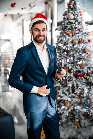 Young man standing in the office buildingの写真素材