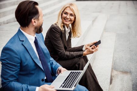 Elegant woman entrepreneur looking at a businessmanの写真素材