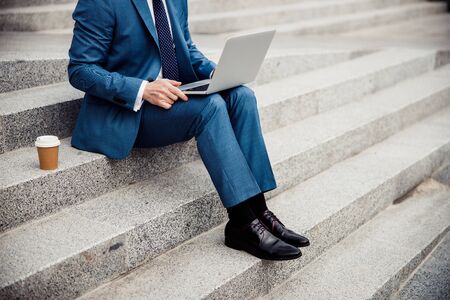 Stylish Caucasian man working on his laptop