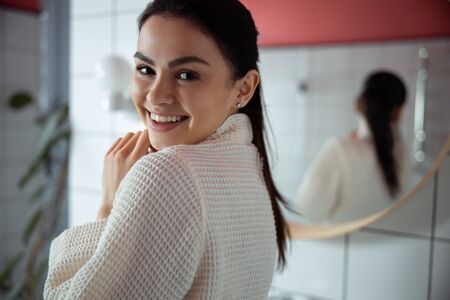 Cheerful young lady at home stock photoの写真素材