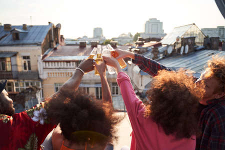 Two couples having party on urban roof