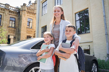 Happy family arriving in city by carの写真素材