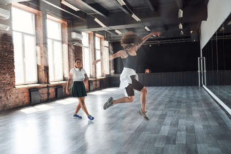Two beautiful happy women in aerobics classの写真素材
