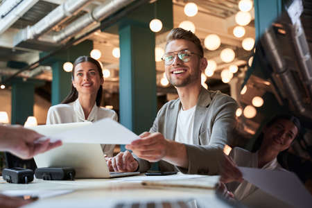 Two ambitious young people feeling happy about their careerの写真素材