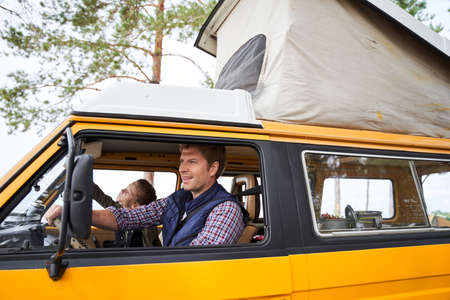 Family traveling by the carの写真素材