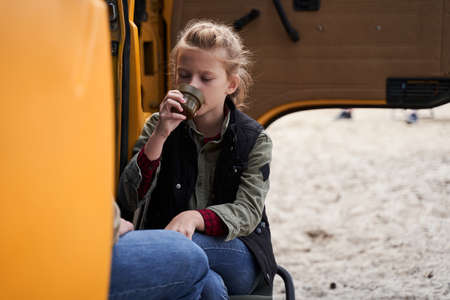 Girl warms up with a hot drink
