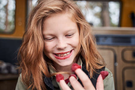 Girl got dirty from the berriesの写真素材