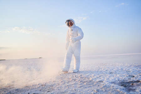 Astronaut walking through fogの写真素材