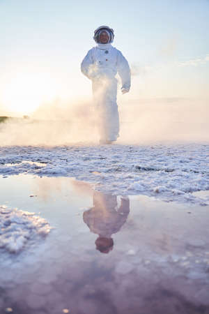 Astronaut walking through fogの写真素材