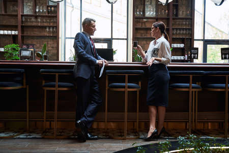 Businessman and businesswoman discussing plans