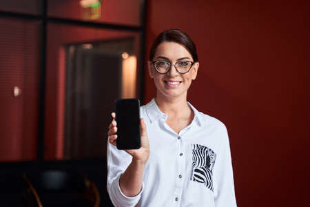 Portrait of smilling businesswoman in glassesの写真素材