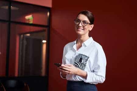 Portrait of brunette businesswoman in glasses