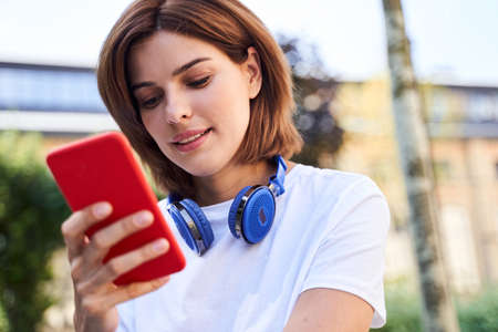 Lady concentrated checking messages on smartphone