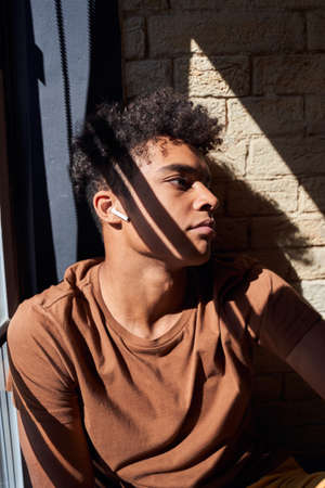 Man listening music and looking to the side