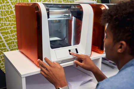 Man using a modern printer machine