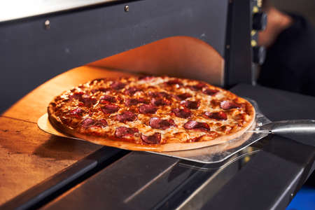 Baking tasty italian pizza conceptの写真素材