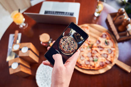 Top view of taking shot of italian pizzaの写真素材