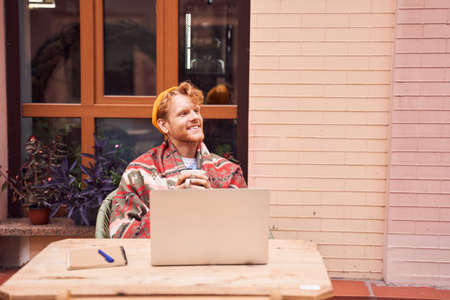 Freelancer working and drinking coffee in cafe