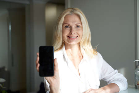 Happy pretty lady is using mobile phone