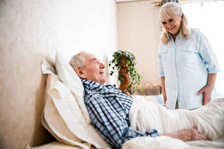 Husband and wife chatting at the bedroom