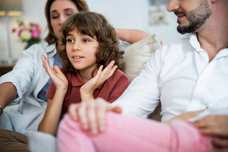Surprised boy is fascinated watching for somethingの写真素材