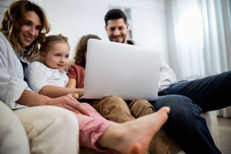 Kids relaxing on couch at home