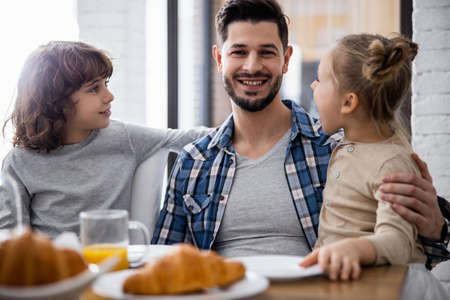 Father with children on both sides of himの写真素材