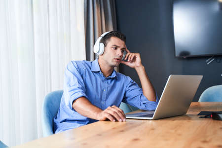 Man is looking at the laptop