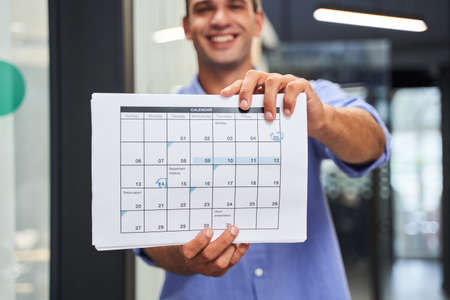 Man showing calendarの写真素材