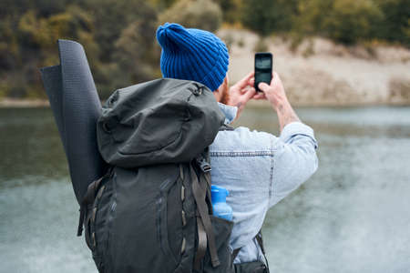 Photographer with big backpackの写真素材