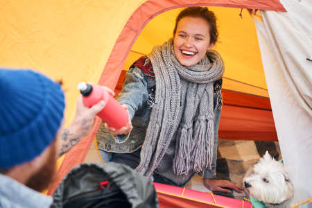 Woman giving a bottle of waterの写真素材