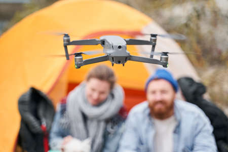 Couple launching a drone