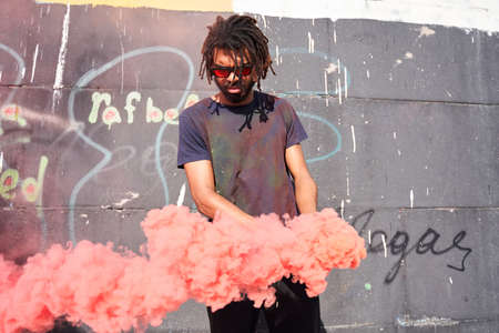 Man holding smoke bomb