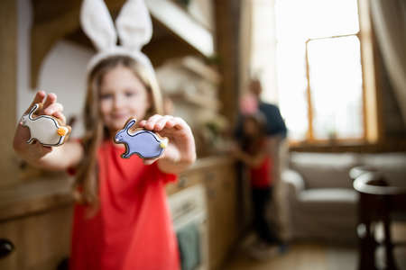 Delicious gingerbreads in hands of girl stock photo