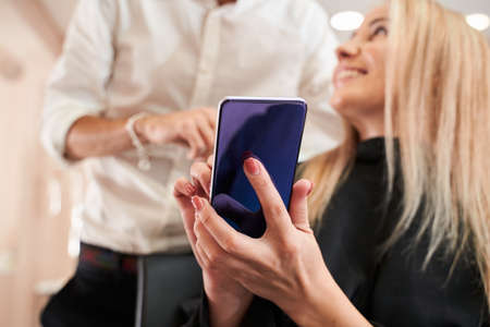 Woman is clipping at her favorite barber