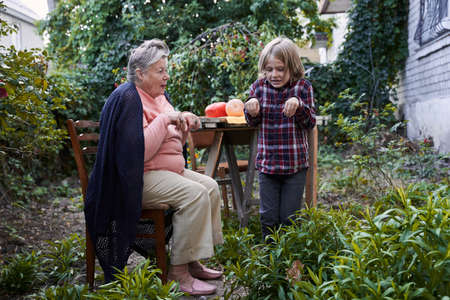 Granny and kid imagine that they are bats