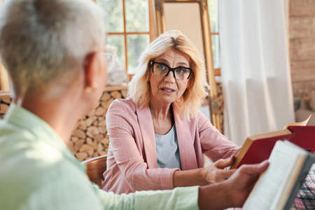 Woman discussing a book with her friend