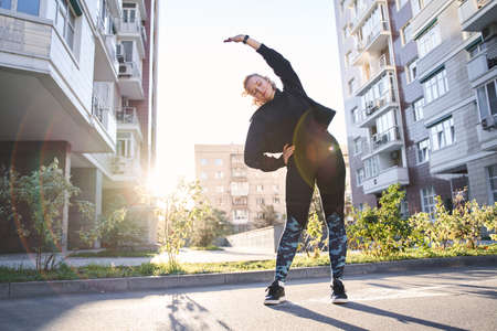 Woman warming up before jogging